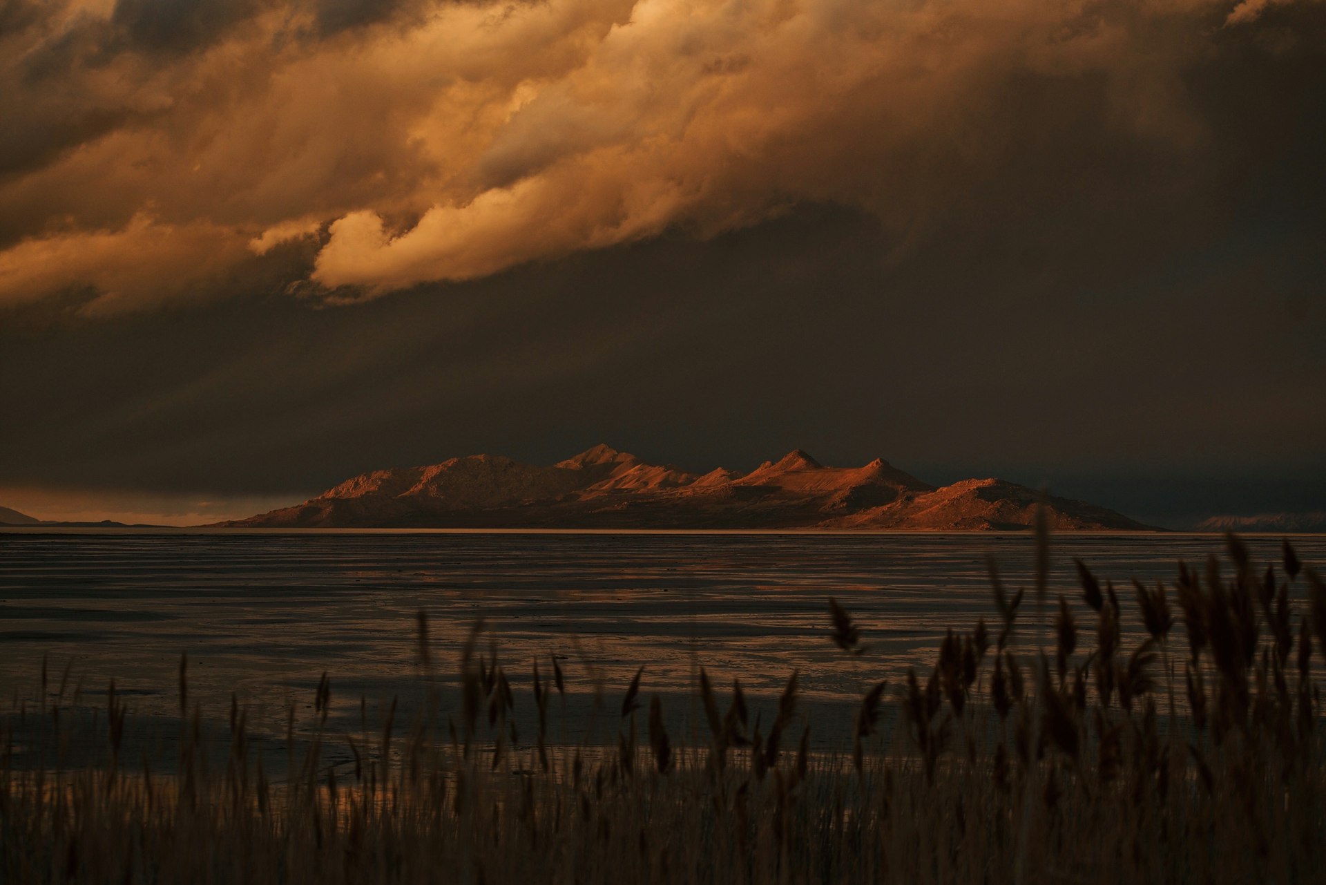 Dramatic sunset over Antelope Island and the Great Salt Lake in Davis County